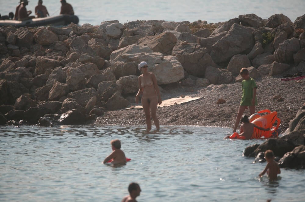 FKK cove pyramid in waters - People find in this a way to understand that the naked body is part of nature and its beauty