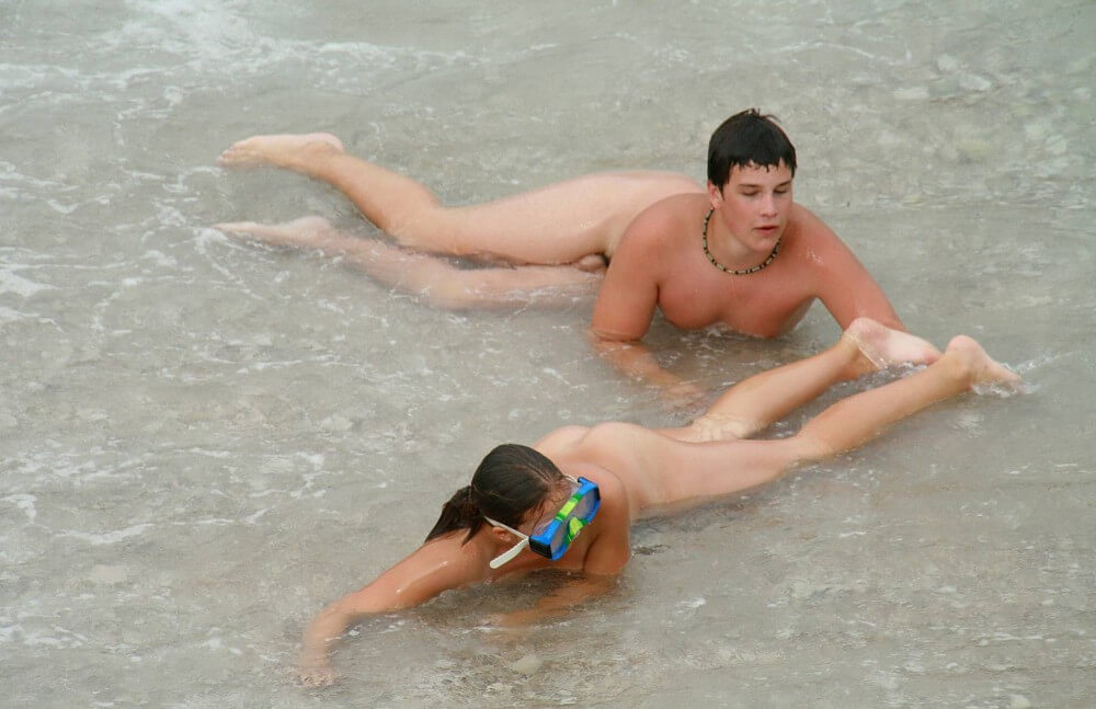 Wading In The Shallows pics - People practice nudism to achieve harmony with nature