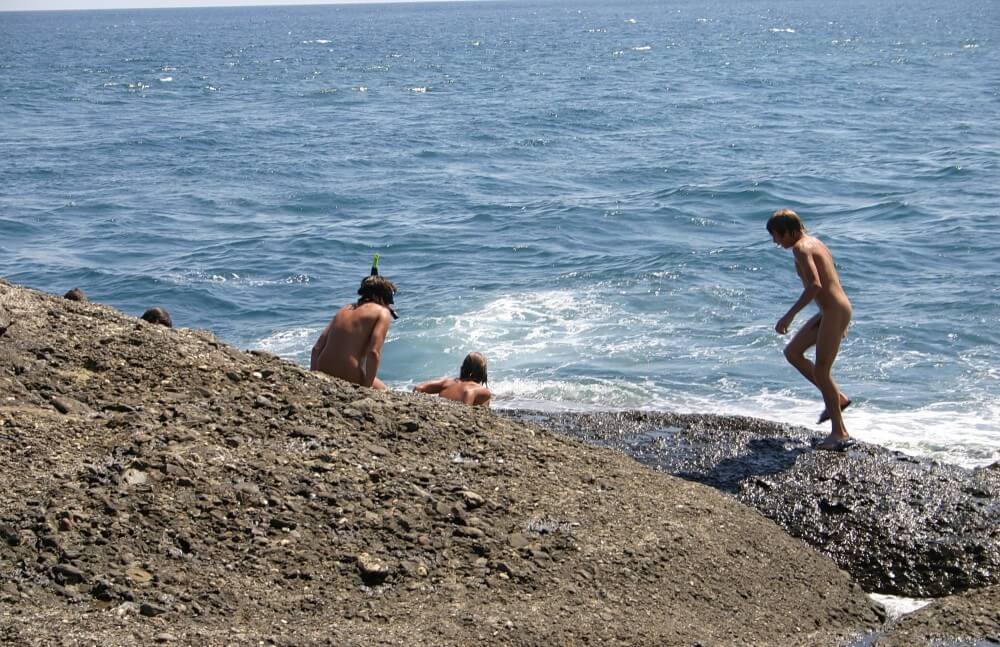 Leaning Against Hit Rocks pics - A naturist strives for inner harmony and emotional balance